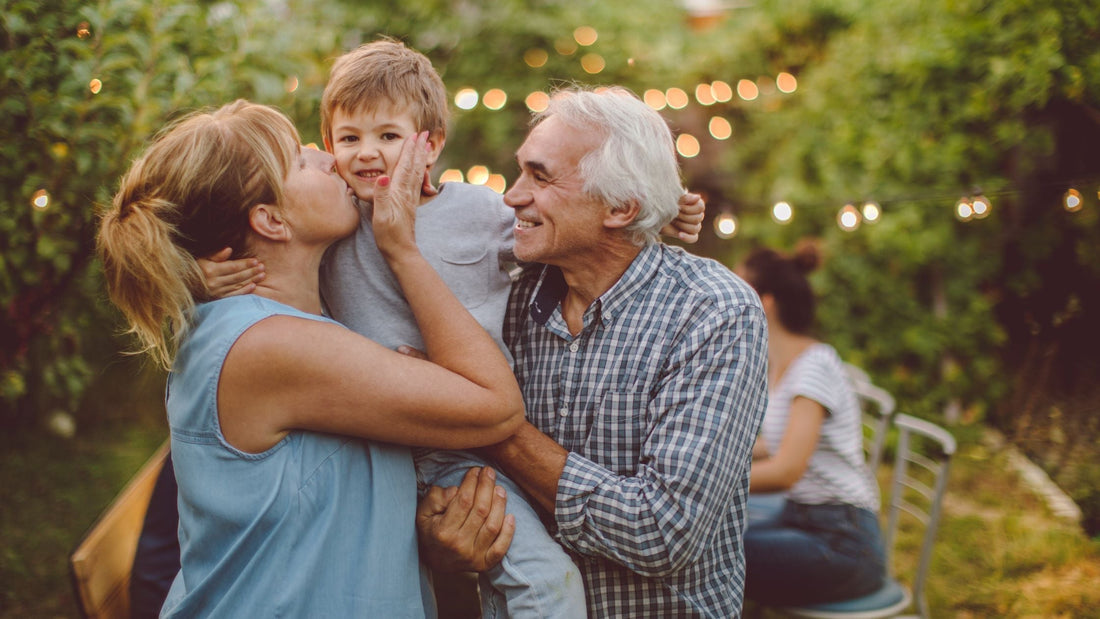 grandparents with grandchild laughing
