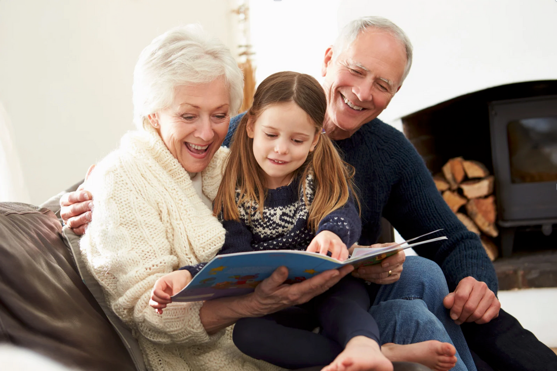 GRANDPARENTS READING WITH GRAND DAUGHTER